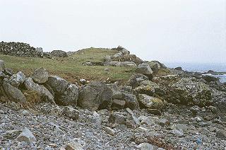 Stones grass and sea